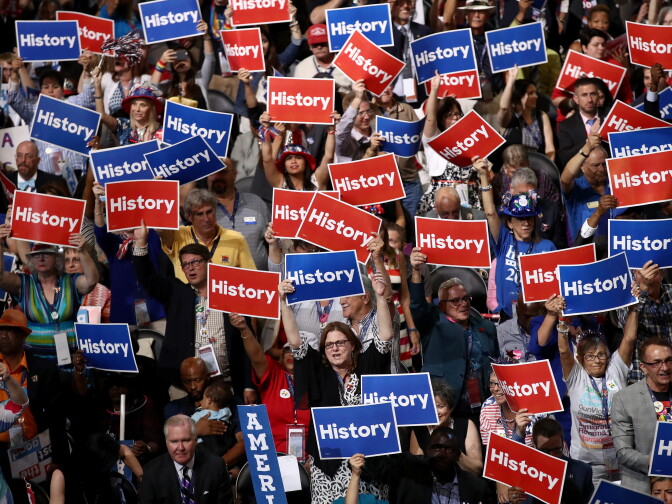 Delegates hold up signs and cheer on the second day of the Democratic National Convention at the Wells Fargo Center, July 26, 2016 in Philadelphia, Pennsylvania.