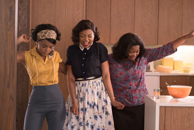Mary Jackson (Janelle Monae, left), Katherine Johnson (Taraji P. Henson) and Dorothy Vaughan (Octavia Spencer) celebrate their stunning achievements in one of the greatest operations in history.  