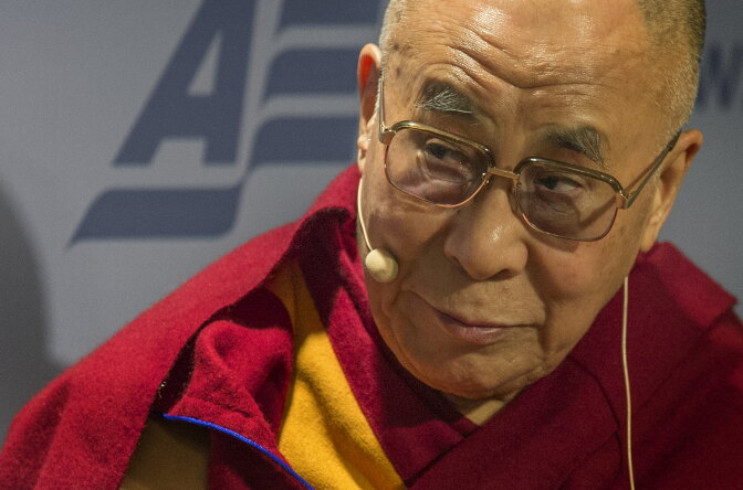 The Dalai Lama speaks at the American Enterprise Institute (AEI) during a panel discussion on 'Happiness, Free Enterprise, and Human Flourishing' in Washington, DC, February 20, 2014. 
