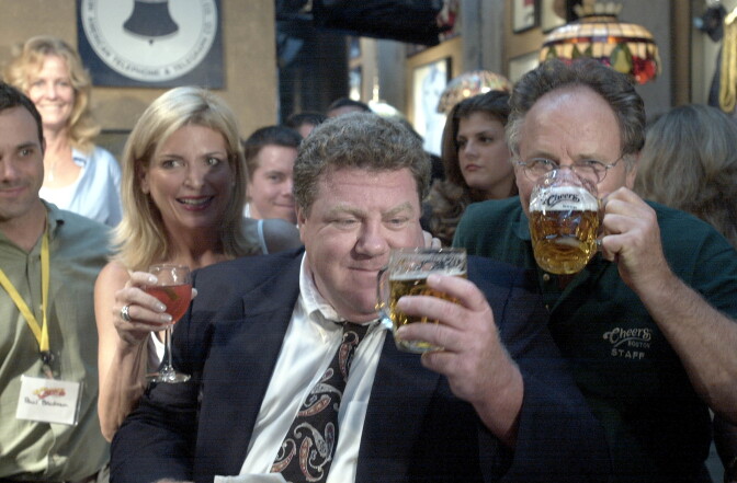 Actor George Wendt, known as Norm on the sitcom "Cheers," looks at his beer August 23, 2001 on opening night at the "Cheers" bar in Boston, Massachusetts. Drinking with him is owner Tom Kershaw who also owns the Bull & Finch Pub, which the popular sitcom is based on.