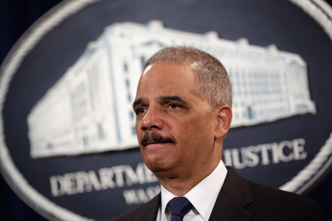 WASHINGTON, DC - MARCH 19:  U.S. Attorney General Eric Holder listens during an announcement at the Justice Department March 19, 2014 in Washington, DC. The Justice Department announced a deferred prosecution agreement with a $1.2 billion fine regarding Toyota Motor Corporation’s misleading to its consumers on the unintended acceleration issues in the cars the company manufactured.  (Photo by Alex Wong/Getty Images)