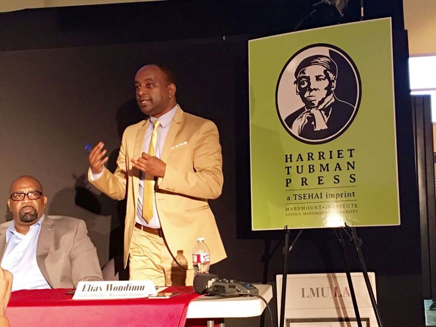 Elias Wondimu announces Harriet Tubman Press at an event at a community discussion of African-American publishing at the Vision Theater in Leimert Park on Monday, Aug. 15, 2016.