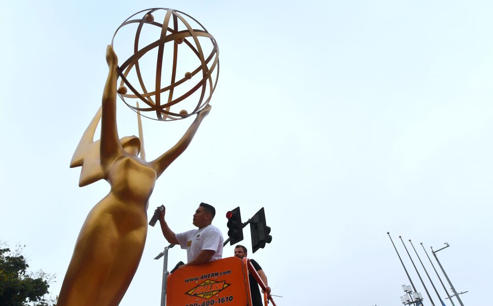 Painter Eddie Garcia touches up a statue of the Emmy Award on Sept. 12, 2017 in Los Angeles, ahead of this weekend's 69th Emmy Awards.
