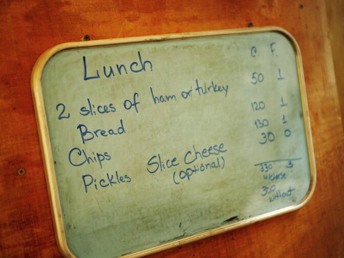 A board in the cafeteria breaks down the calories and fat grams for each meal.  A full salad bar is always offered.