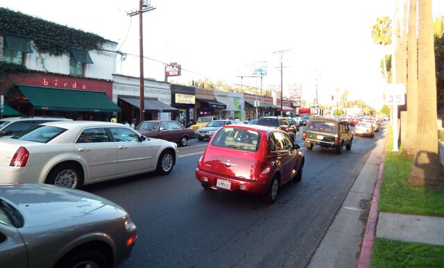 Cars in heavy traffic along Franklin Boulevard in front of The Strip