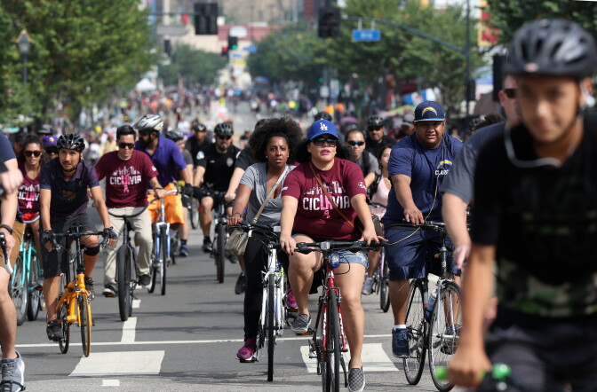 Cyclists ride open streets in downtown Los Angeles on Sunday, Oct. 18, 2015. Six miles of streets in and around downtown Los Angeles were closed to motor vehicles as the city's fifth anniversary celebration of the CicLAvia festival opened the lanes to cyclists, skaters and pedestrians.