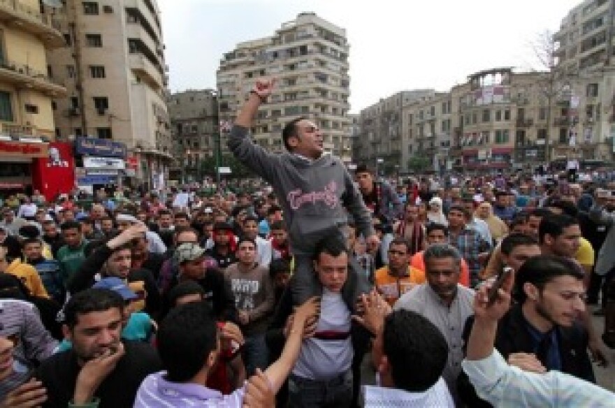 Protesters chant slogans as they march following an attack by security forces in Tahrir Square, in Cairo, Egypt, Saturday, April 9, 2011. Demonstrators burned cars and barricaded themselves with barbed wire inside a central Cairo square demanding the resignation of the military's head after troops violently dispersed an overnight protest killing one and injuring scores.