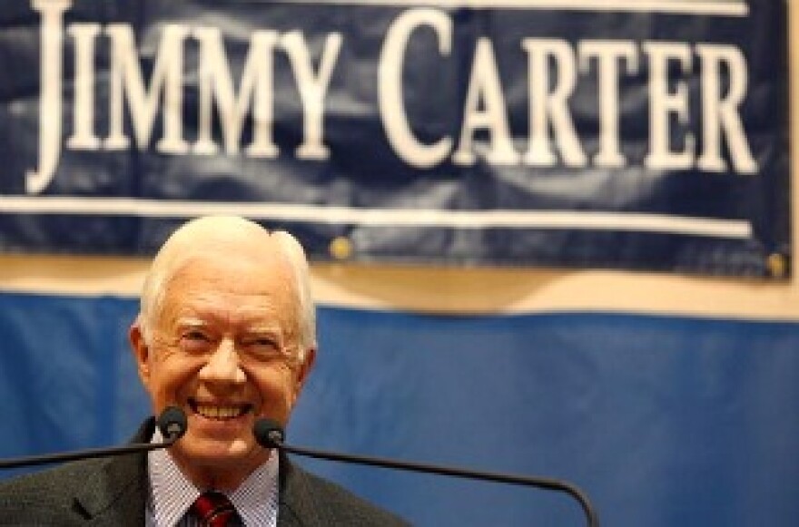 Former President Jimmy Carter smiles at the crowd at Emory University in Atlanta, Georgia.