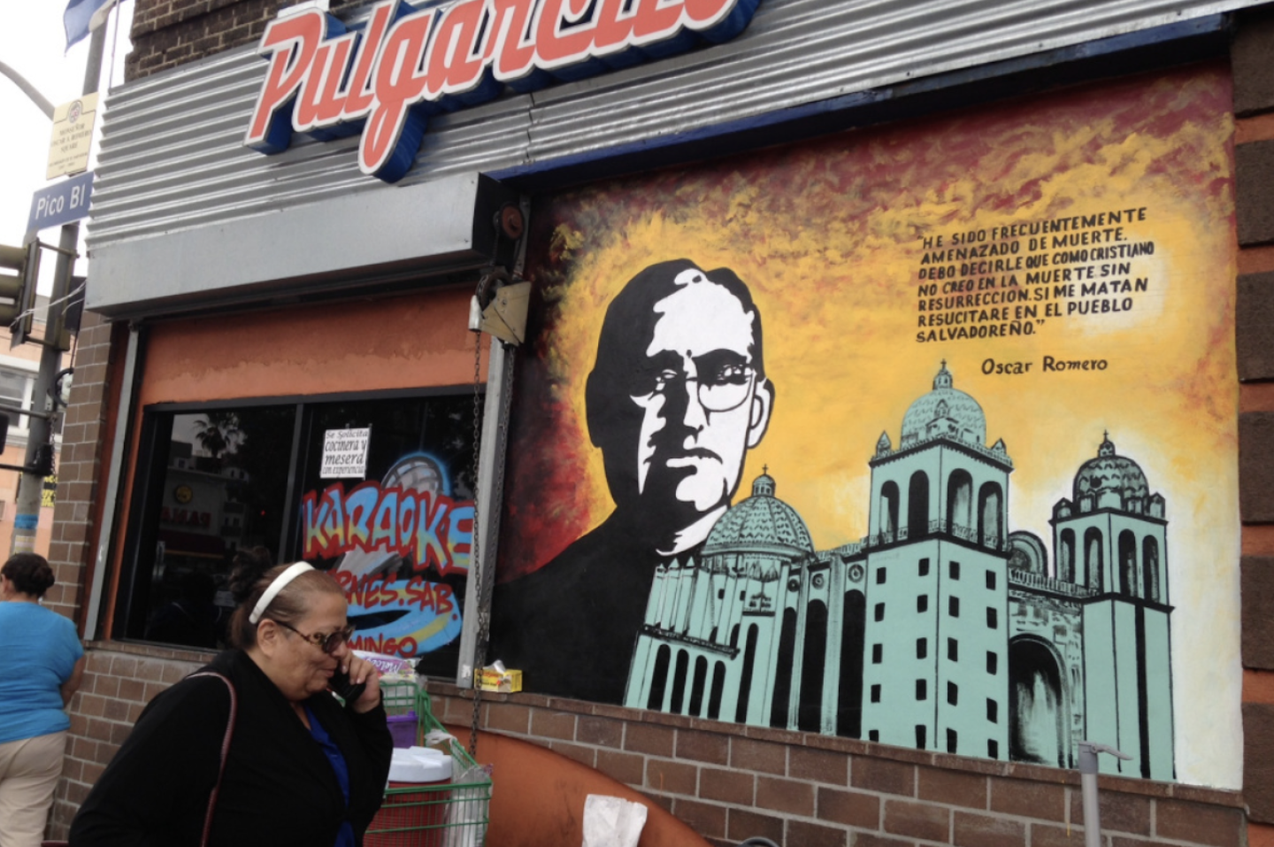 A likeness of Archbishop Oscar Romero, who was assassinated in 1980 near the start of the civil war in El Salvador, on a mural off a stretch of Vermont Ave. known as the El Salvador Community Corridor.