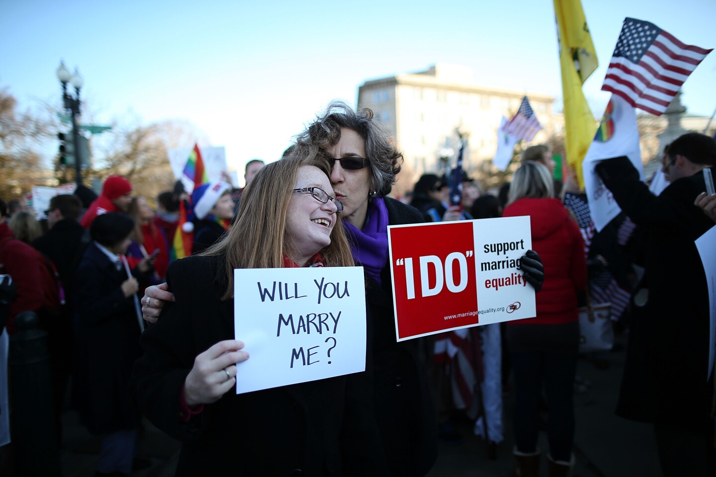 Andrea Grill (R) and Lee Ann Hopkins (L), from Alexandria VA. embrace after becoming engaged during a rally outside of the U.S Supreme Court, on March 26, 2013 in Washington, DC. Today the high court is scheduled to hear arguments in California's proposition 8, the controversial ballot initiative that defines marriage as between a man and a woman.  