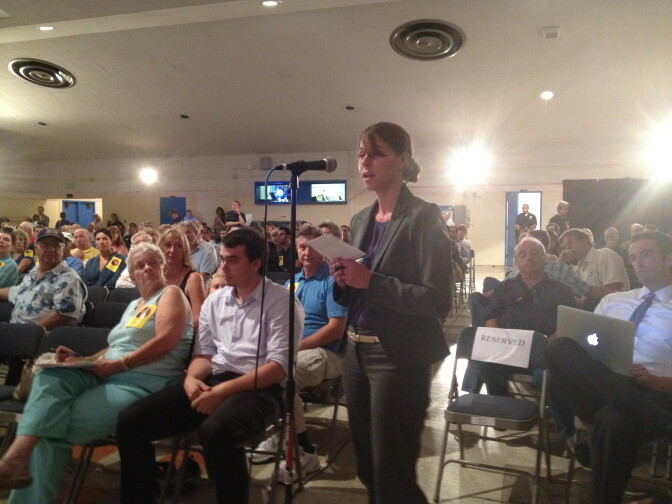 A woman who lives in the City of Lomita talks about the helicopters that fly over her neighborhood at a Federal Aviation Administration public hearing. 