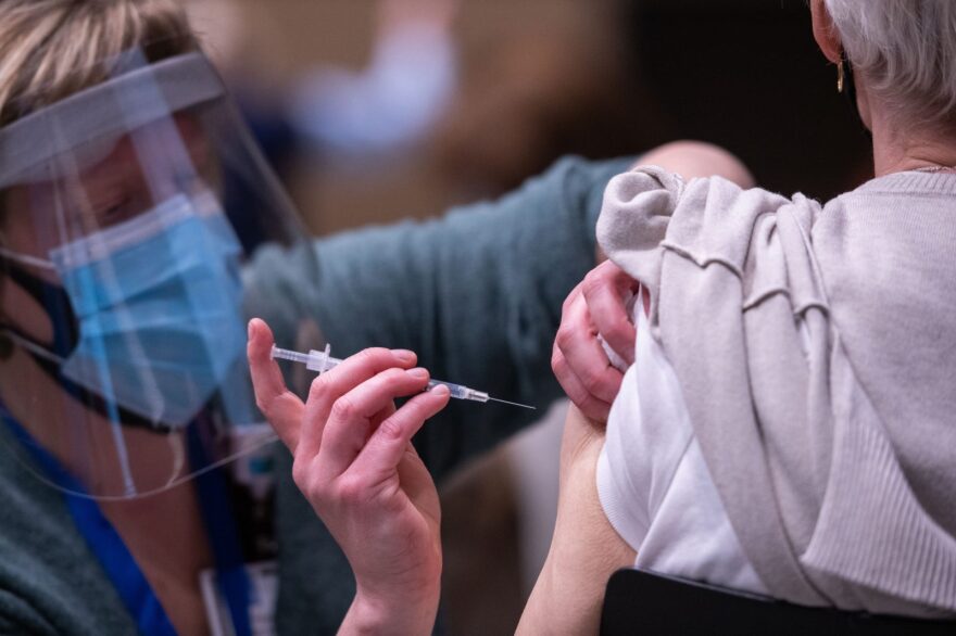 Advanced registered nurse practitioner Erin Forsythe administers the COVID-19 vaccine in Seattle, Washington. 