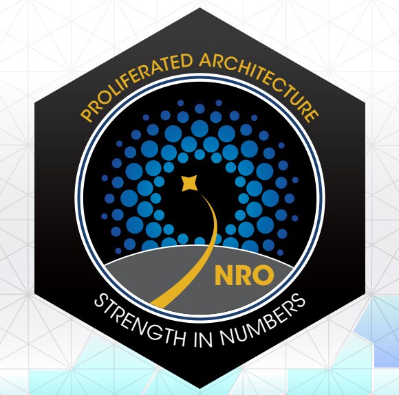 A logo of a shooting star in a circle with text around it that reads "Proliferated architecture. Strength in numbers" and "NRO" inside the circle.