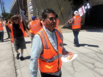 Daniel Linares, 58, eats lunch on the picket line outside
Pacific 9 Transportation in Carson on Monday, April 27, 2015. Linares has been an independent contractor with the company for seven years.