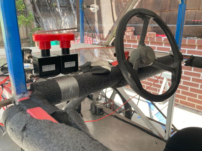 A driver's seat of the Poly Solar Team's sun-powered car. The outside bars of the car are surrounded by padded roll bars.