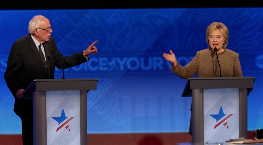 Democratic president candidates Bernie Sanders and Hillary Clinton debate at Saint  Anselm College December 19, 2015 in Manchester, New Hampshire.