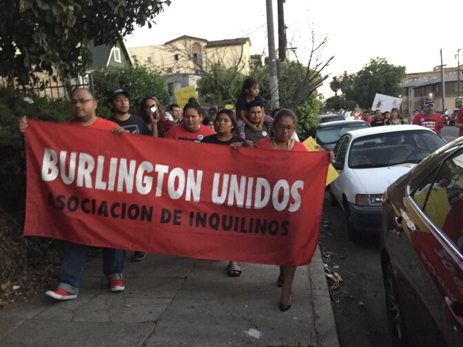 Striking tenants in Westlake march through their neighborhood in late July (Matt Tinoco/SCPR)