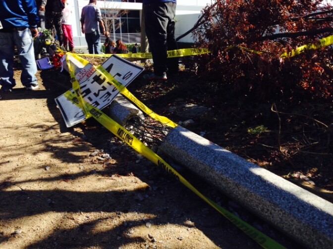 A pole reportedly struck by the car that carried Paul Walker and Roger Rodas lies broken at the scene of the crash in Valencia on December 1, 2013.