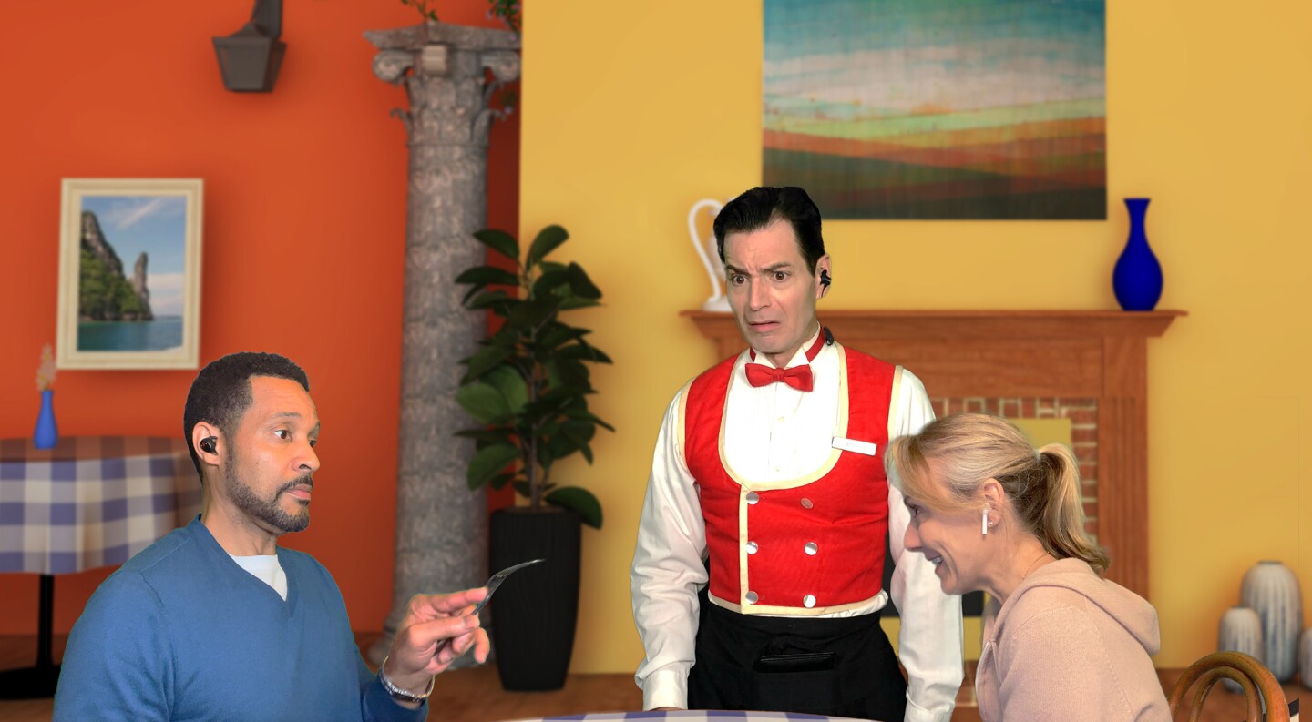two people at a table ordering from a distraught waiter