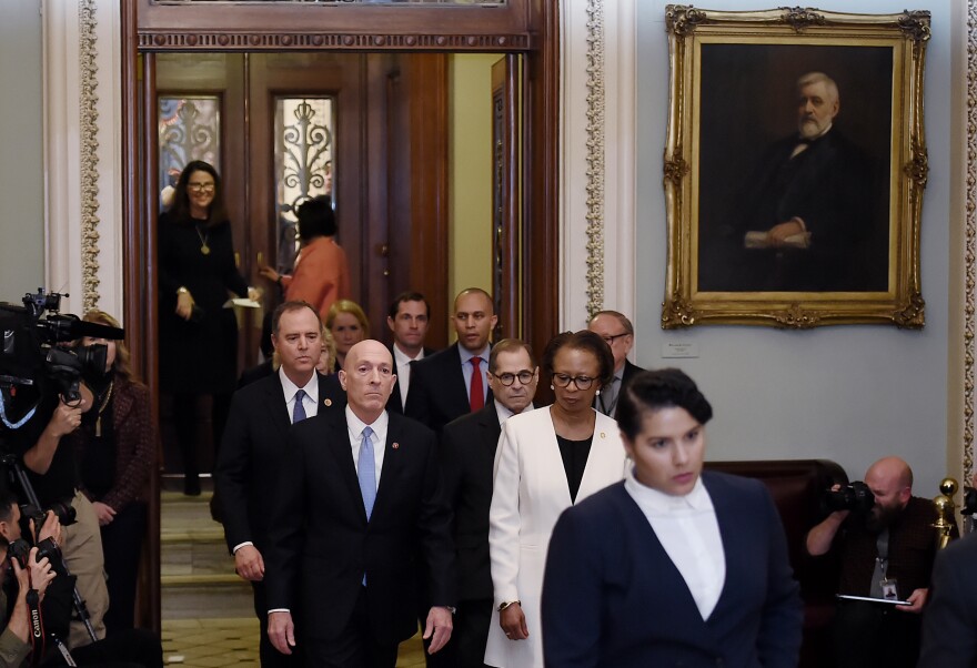 The House SAA Paul Irving (L0 and House clerk Cheryl Johnson (2nd R) followed by Impeachment Managers leave the Senate Chamber after delivering the Impeachment Articles of US President Donald Trump signed by Speaker of the House Nancy Pelosi on Capitol Hill January 15, 2020, in Washington, DC. - The US House of Representatives voted Wednesday to transmit articles of impeachment against President Donald Trump to the Senate, opening the way for the historic trial of the 45th president for abuse of power. (Photo by OLIVIER DOULIERY / AFP) (Photo by OLIVIER DOULIERY/AFP via Getty Images)