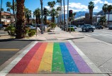 A crosswalk painted in rainbow colors