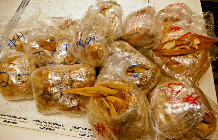 Photo released by the U.S. Customs and Border Protection shows seized 450 prohibited pork tamales discovered inside the luggage of a passenger arriving at Los Angeles International Airport from Mexico, on Nov. 2, 2015.