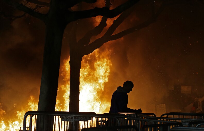 A bonfire set by demonstrators protesting a scheduled speaking appearance by Breitbart News editor Milo Yiannopoulos burns on Sproul Plaza on the University of California at Berkeley campus on Wednesday, Feb. 1, 2017, in Berkeley, Calif. The event was canceled out of safety concerns after protesters hurled smoke bombs, broke windows and started a bonfire. (AP Photo/Ben Margot)