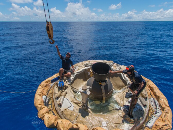 Divers retrieve the test vehicle for NASA's Low-Density Supersonic Decelerator off the coast of the U.S. Navy's Pacific Missile Range Facility in Kauai, Hawaii.
