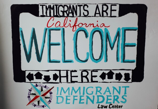 Handmade sign by one of the lawyers at the Immigrant Defenders Law Center
