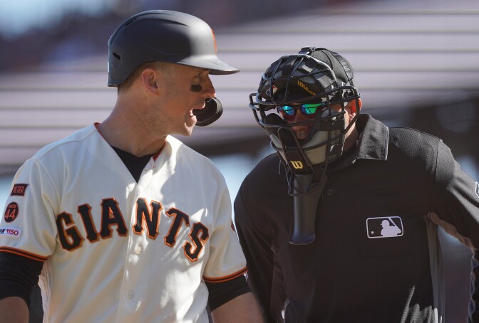 SAN FRANCISCO, CALIFORNIA - SEPTEMBER 28: Buster Posey #28 of the San Francisco Giants argues with home plate umpire Roberto Ortiz #40 after Ortiz called Posey out on strikes against the Los Angeles Dodgers in the bottom of the eighth inning at Oracle Park on September 28, 2019 in San Francisco, California. (Photo by Thearon W. Henderson/Getty Images)