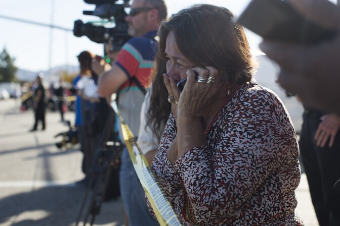 Olivia Navarro, 63, waits to hear the status of her daughter, Jamil Navarro, who works in the Inland Regional Center in San Bernardino where a mass shooting took place on Wednesday, Dec. 2, 2015.