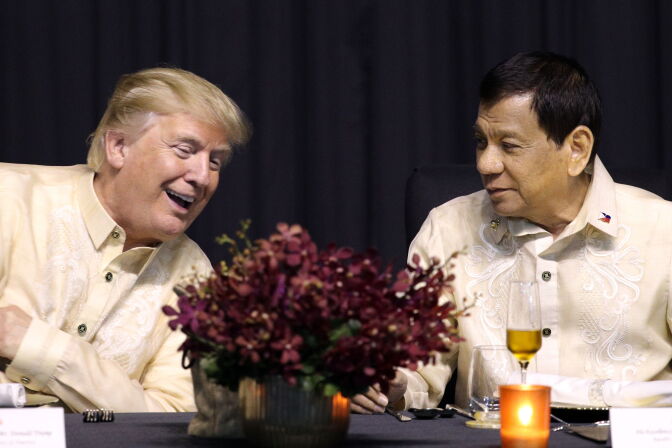 US President Donald Trump (L) speaks with Philippines President Rodrigo Duterte during a special gala celebration dinner for the Association of Southeast Asian Nations (ASEAN) in Manila on November 12, 2017.
World leaders arrive in the Philippines' capital for two days of summits beginning on November 13.  / AFP PHOTO / POOL / ATHIT PERAWONGMETHA        (Photo credit should read ATHIT PERAWONGMETHA/AFP/Getty Images)
