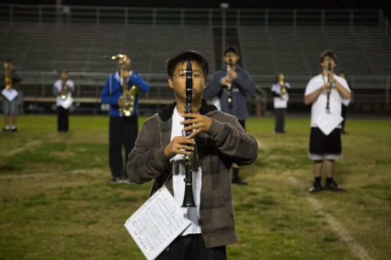 A clarinet player prepares before a run-through of the group's show for state championships.