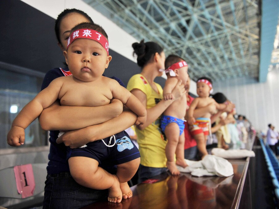 Hundreds of Chinese babies prepare to participate in a swimming contest in September in Beijing. In China, children with no siblings often find concession difficult to deal with, since their parents traditionally give in to their demands.