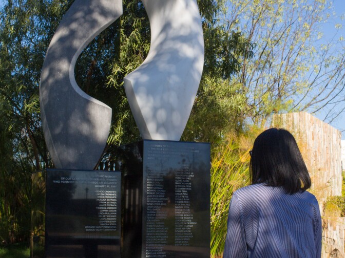 Christina Chang takes a moment to reflect at the memorial for those killed in the 1986 air disaster over Cerritos at the Cerritos Scultpure Garden on Jan. 28, 2018 in Cerritos.