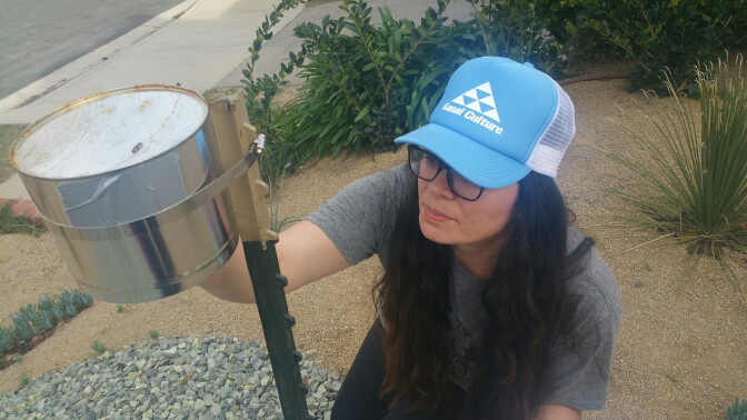 UC Berkeley PhD student Diane Garcia-Gonzales takes readings from a monitor placed in the front yard of a Porter Ranch home on Jan. 29th, 2016. Garcia-Gonzales is one of the students volunteers helping UCLA Environmental Health Scientist, Michael Jerrett, take independent air samples at the site of the Southern California Gas Company leak at its Aliso Canyon Storage Facility.  