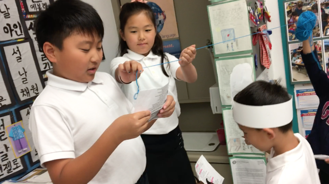 Students in the Korean dual language program at Cahuenga Elementary in Los Angeles' Koreatown neighborhood walk through a role-playing exercise on Weds., May 30, 2018.