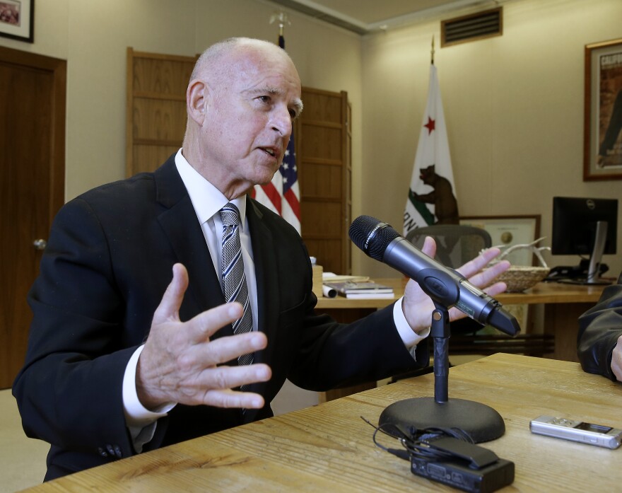 Gov. Jerry Brown discusses his re-election while taking with reporters at his Capitol office in Sacramento, Calif., Wednesday, Nov. 5, 2014. (AP Photo/Rich Pedroncelli)