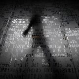 TOPSHOT - A picture taken on October 17, 2016 shows an employee walking behind a glass wall with machine coding symbols at the headquarters of Internet security giant Kaspersky in Moscow. / AFP / Kirill KUDRYAVTSEV / TO GO WITH AFP STORY BY Thibault MARCHAND        (Photo credit should read KIRILL KUDRYAVTSEV/AFP/Getty Images)