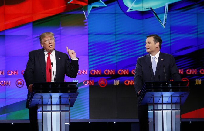 Republican presidential candidate, businessman Donald Trump speaks, as Republican presidential candidate, Sen. Ted Cruz, R-Texas, listens, during the Republican presidential debate sponsored by CNN, Salem Media Group and the Washington Times at the University of Miami,  Thursday, March 10, 2016, in Coral Gables, Fla. (AP Photo/Wilfredo Lee)