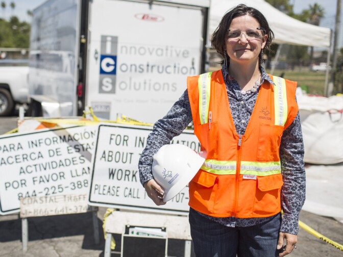 Sarah Cromie is senior environmental scientist at the California Department of Toxic Substances Control. Cromie stands outside a soil removal, part of the Exide cleanup through the department, at an East Los Angeles home on Wednesday, April 20, 2016.