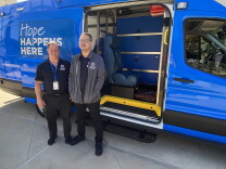  Lance Lindgren (L) and Laxon Sumawiganda (R) of Be Well OC stand in front of one of the new blue mobile response vans