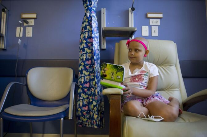Isabella Osorio, 9, affected by cancer, rests during her chemotherapy session. Recent research suggests existence of cancer stem-cells.