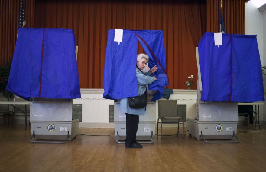 Lilyan Maitan stands in a voting booth during the Republican primary election April 24, 2012 at St. George Greek Orthodox Church in Philadelphia, Pennsylvania. Turnout is expected to be low as Former Massachusetts Gov. Mitt Romney continues his campaign as the presumptive GOP candidate.   