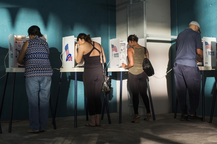 Voters cast their ballots at Echo Park Deep Pool in Los Angeles on Tuesday afternoon, Nov. 8, 2016.