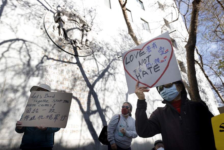 SAN FRANCISCO, CALIFORNIA - MARCH 22: People hold signs during a rally in solidarity with Asian hate crime victims outside of the San Francisco Hall of Justice on March 22, 2021 in San Francisco, California. Hundreds of people rallied in support of the family of Vichar Ratanapakdee, a Thai immigrant who died following an assault in downtown San Francisco. Violent crimes against the Asian community in the San Francisco Bay Area are on the rise. (Photo by Justin Sullivan/Getty Images)