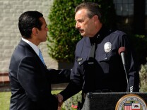 Los Angeles Mayor Antonio Villaraigosa (L) congratulates Los Angeles Police Department Deputy Chief Charles Beck after he was announced as the mayor's selection to be the new Chief of Police at a news conference at the Getty House, the official residence of the mayor, on Nov. 3, 2009 in Los Angeles.