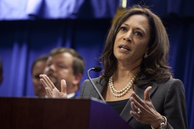 California Attorney General Kamala Harris speaks to reporters following a federal money laundering sweep of downtown Los Angeles businesses in the Fashion District.