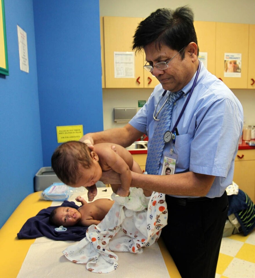 Dr. Hasmukh Amin, a Bakersfield pediatrician, accepts Medi-Cal patients, but says he has to turn away 25-30 people every day who are seeking a pediatrician treating Medi-Cal patients. Here he examines Marcus and Major Thompson.