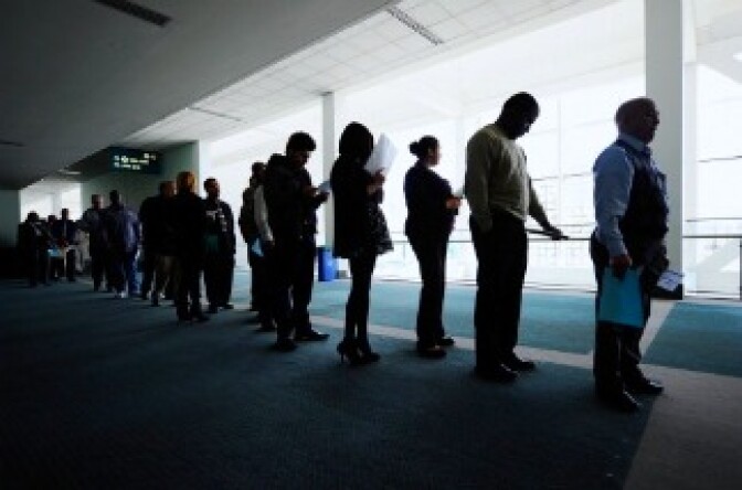 Job seekers line up to enter Choice Career Fair at the Los Angeles Convention Center on December 1, 2010 in Los Angeles, California.